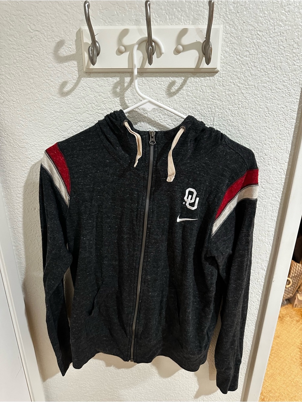Nike Black zip up with Crimson and White Shoulder Stripes